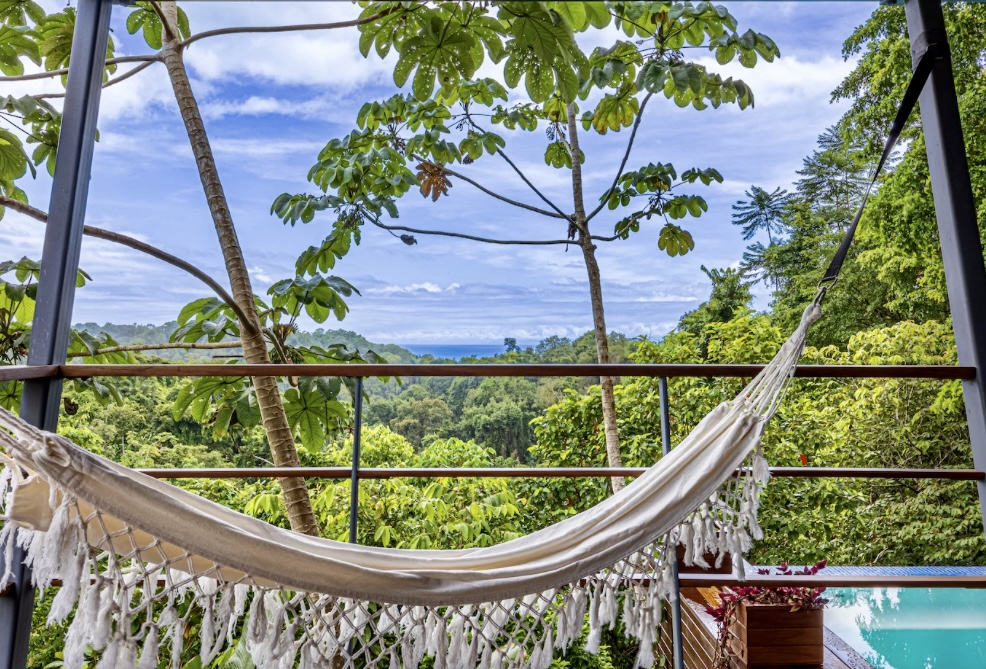 Wrap-around deck overlooking rainforest in Drake Bay