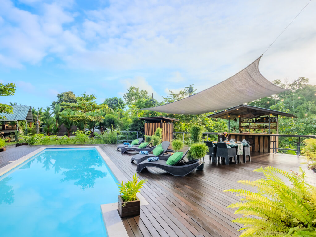 Luxury lodge with large pool surrounded by the rainforest