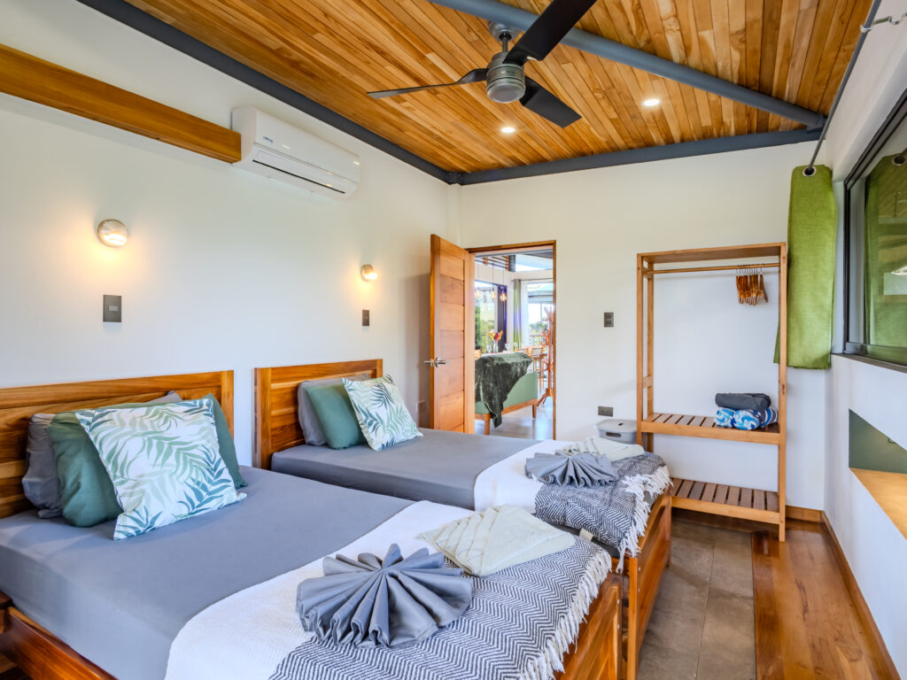 Twin single beds in the rainforest suite